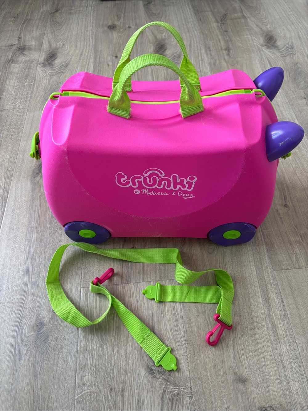 Trunki Kids Ride-On Suitcase by Melissa & Doug - Bright Pink with Green Accents